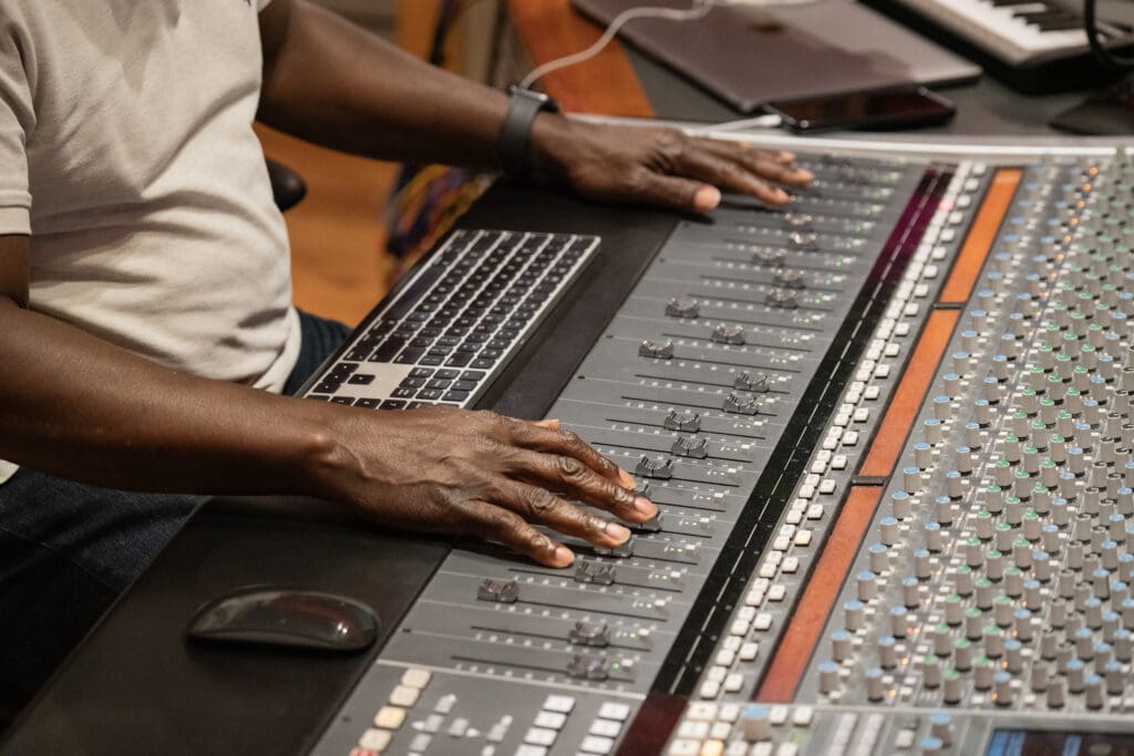 Hands touching a digital audio workstation