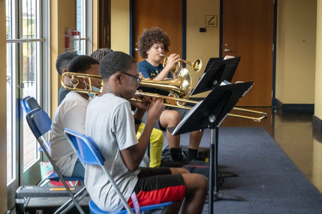 A group of students practicing their instruments.